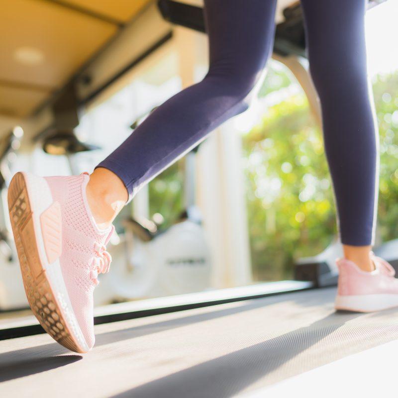 Portrait asian woman exercising and workout by running in gym for healthy